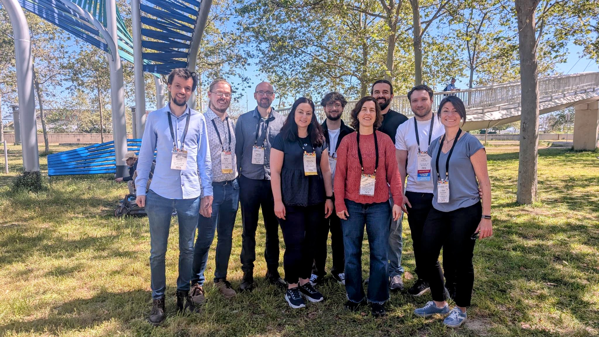 Group picture: UBT team in front of the CHI 2026 sign in the conference hall.